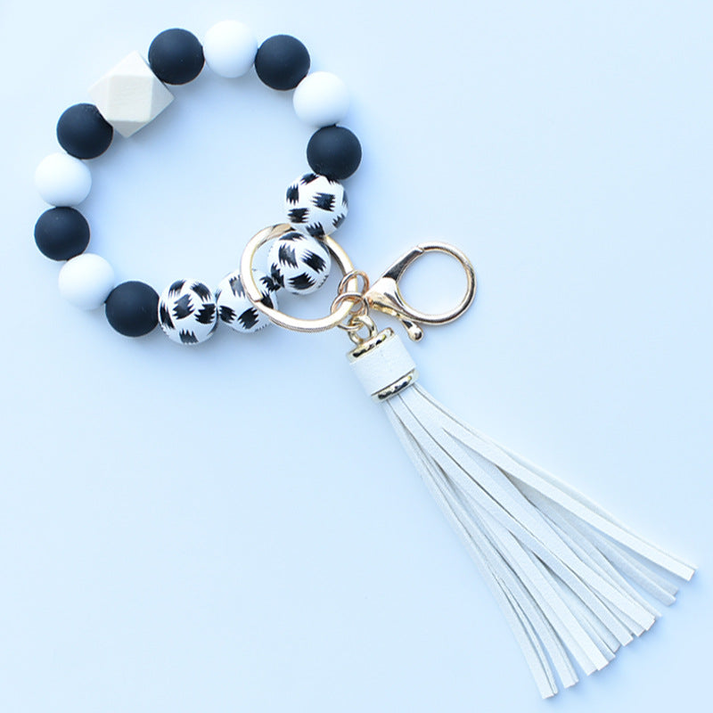 Wholesale Colorful leopard print silicone beaded bracelet keychain PU tassel pendant